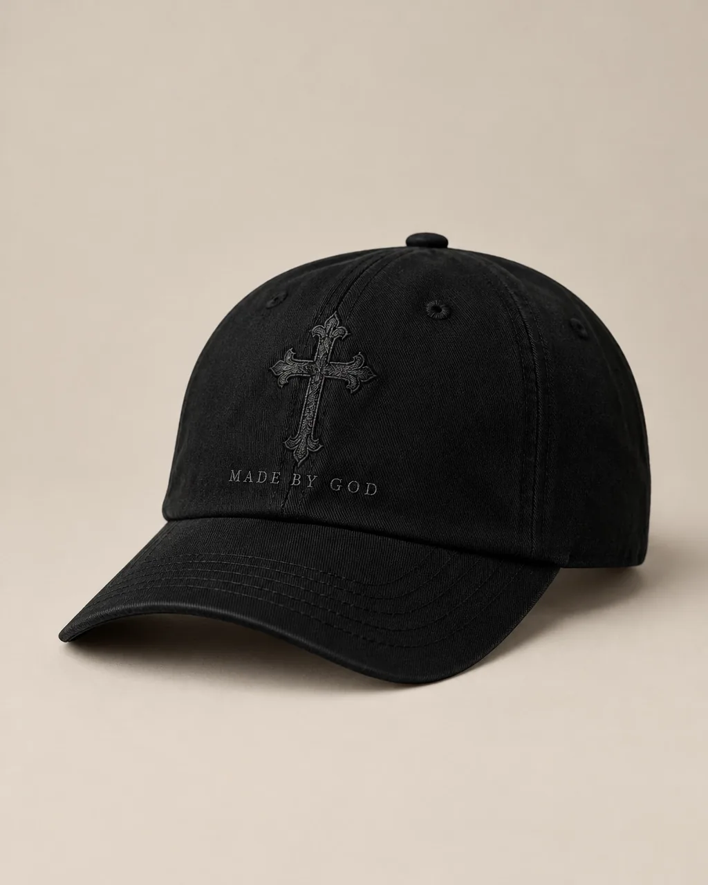 Black cap embroidered with the MBG cross emblem and Made By God lettering